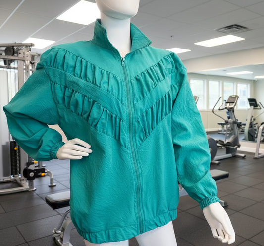 Teal jacket on a mannequin in an indoor setting