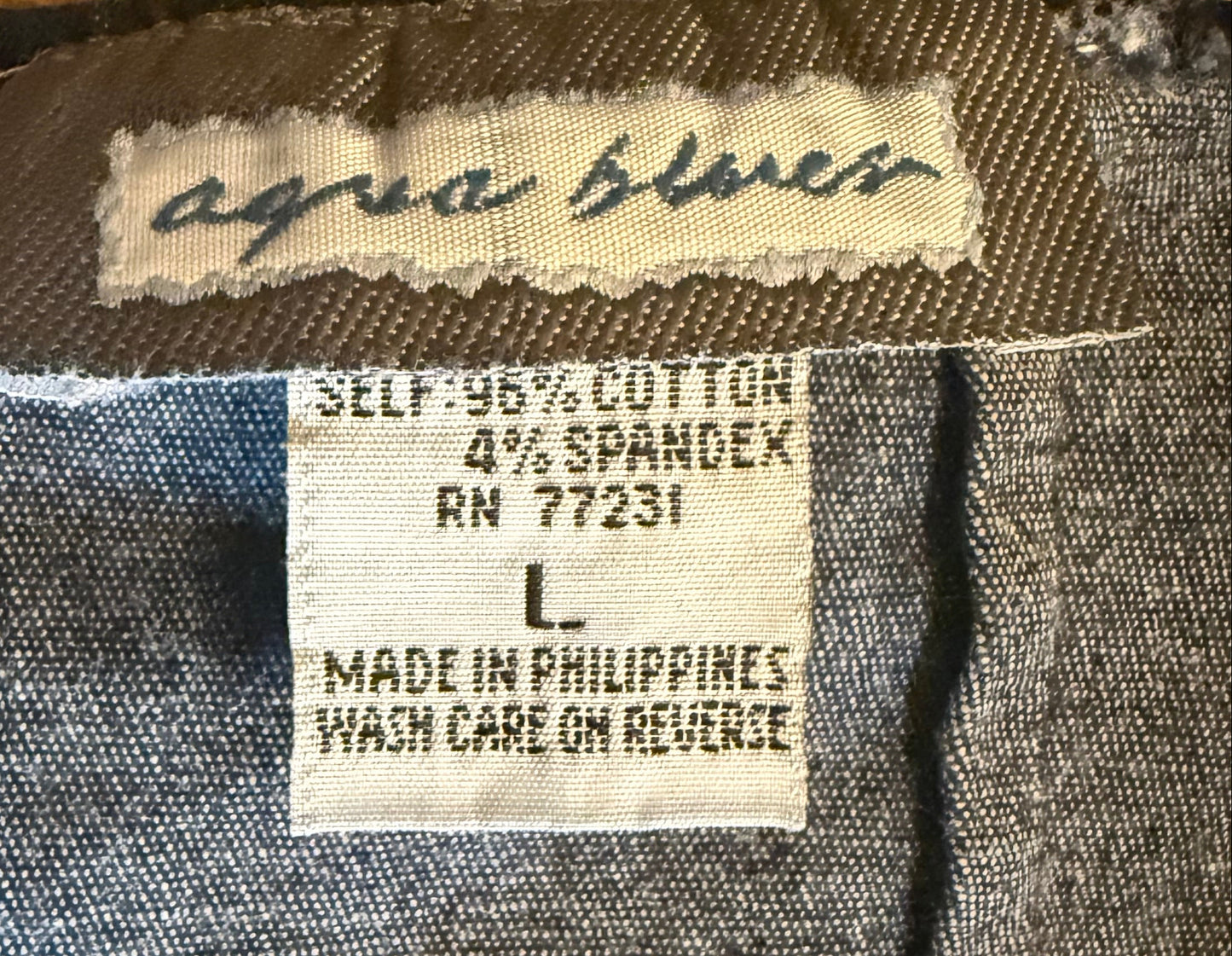 Close-up of a label on a denim fabric with visible text Y2K dress