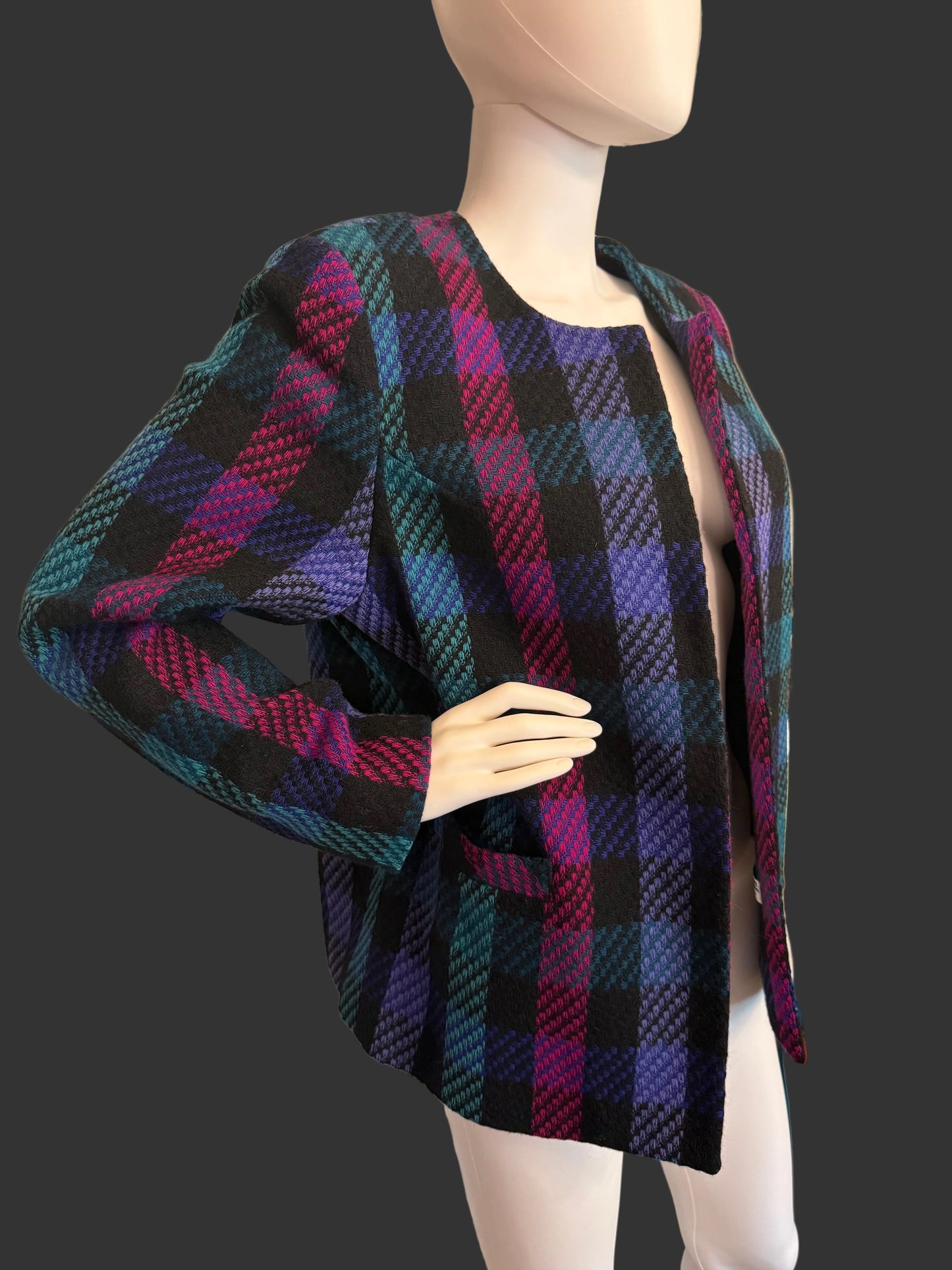 Plaid fabric draped over a mannequin in a room setting