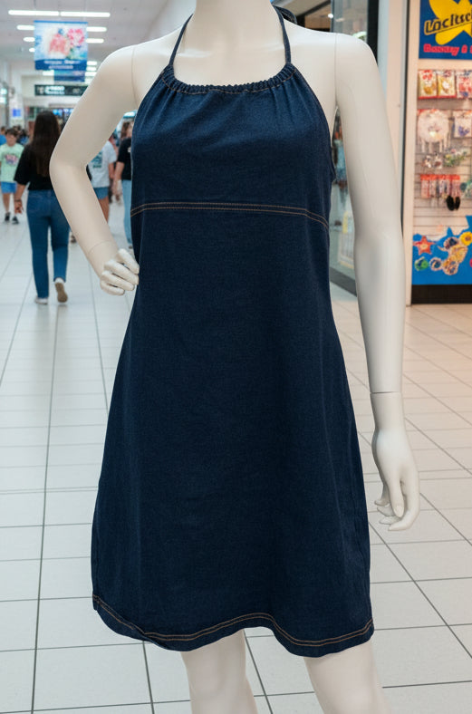 Mannequin wearing a navy denim dress in a mall