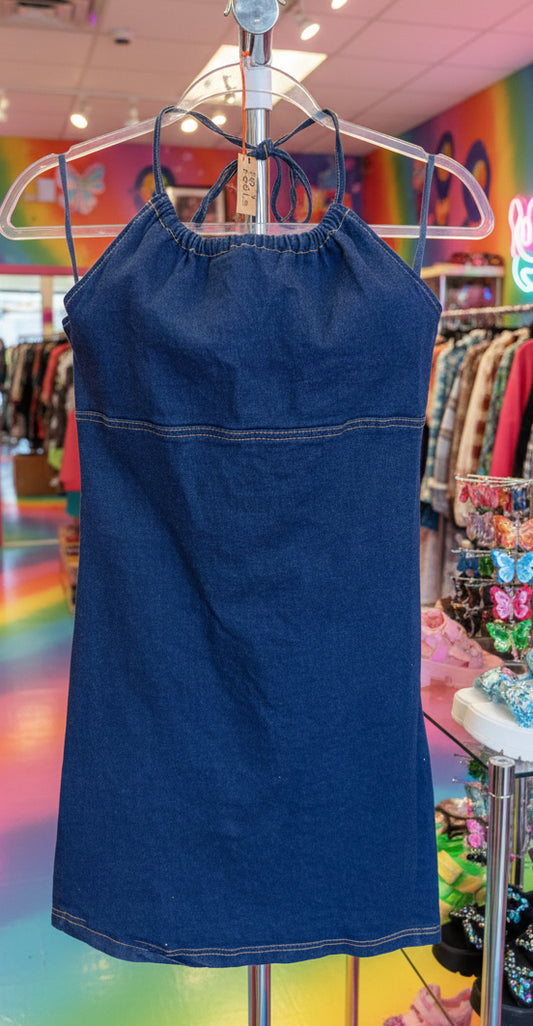 Blue denim Y2K dress on a hanger with a blurred background