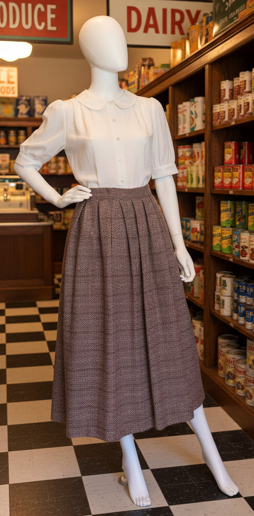 Mannequin in a vintage store setting with shelves stocked with products and a checkered floor.